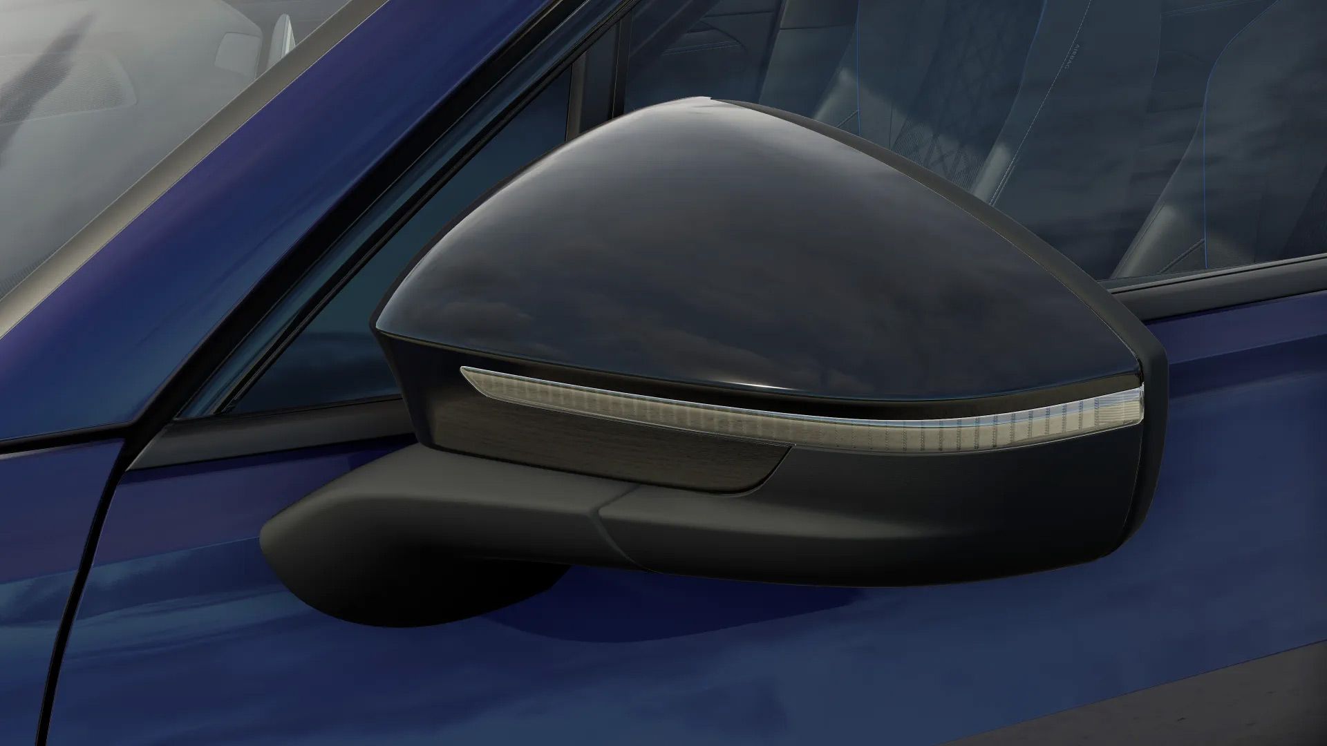 Detailansicht der Außenspiegle eines VW Tayron mit schwarzem Gehäuse.