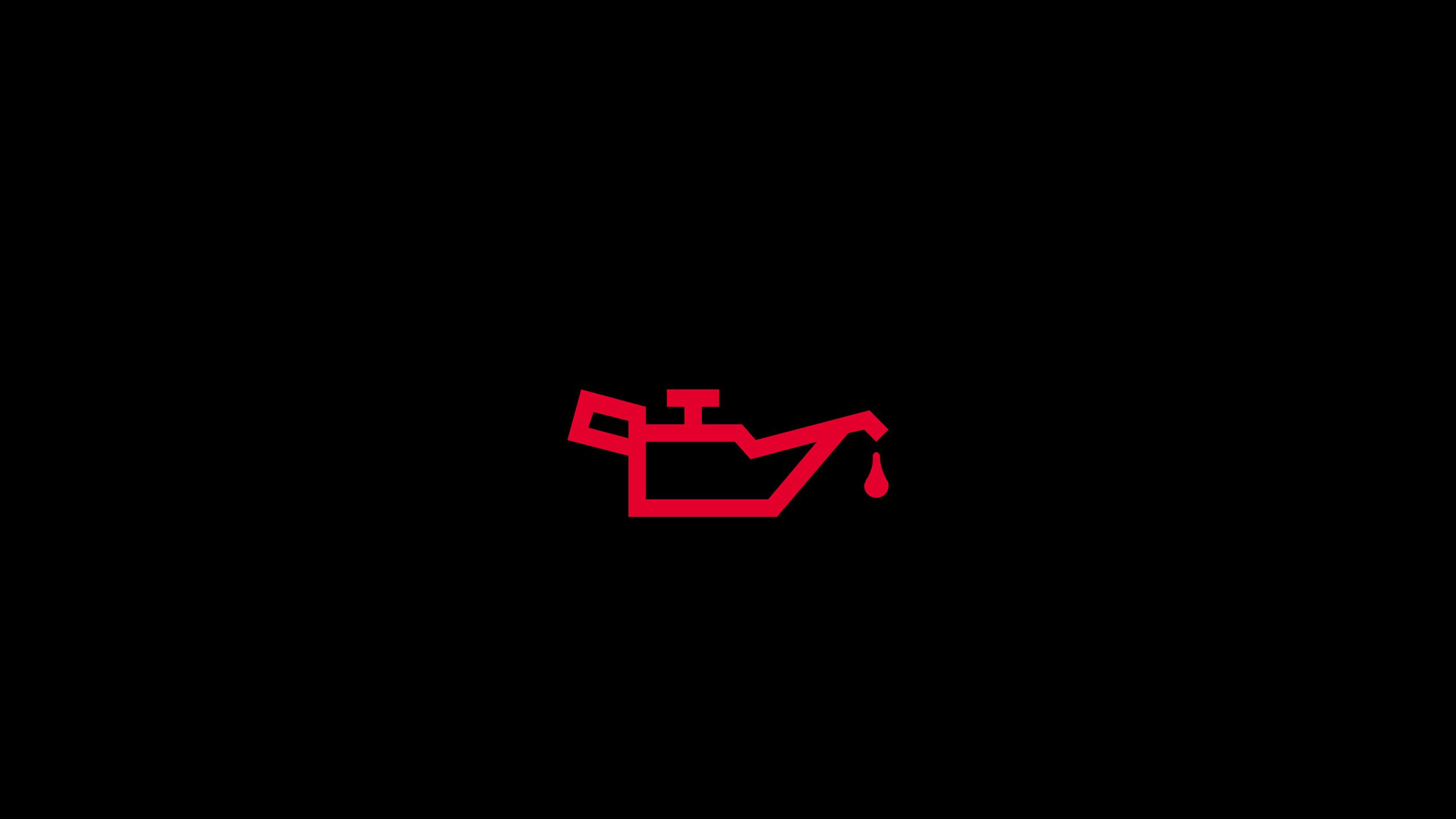 Ein rotes Symbol auf schwarzem Hintergrund zeigt eine Ölkannengrafik mit einem Tropfen Öl. Dies deutet normalerweise auf ein Problem mit dem Motoröl eines Fahrzeugs hin.