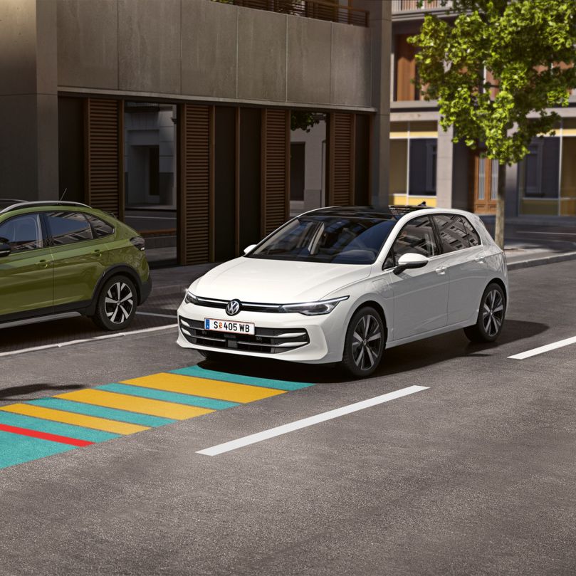 Illustration zeigt schematisch anhand eines VW Golf die Funktionsweise der Ausstiegswarnung.