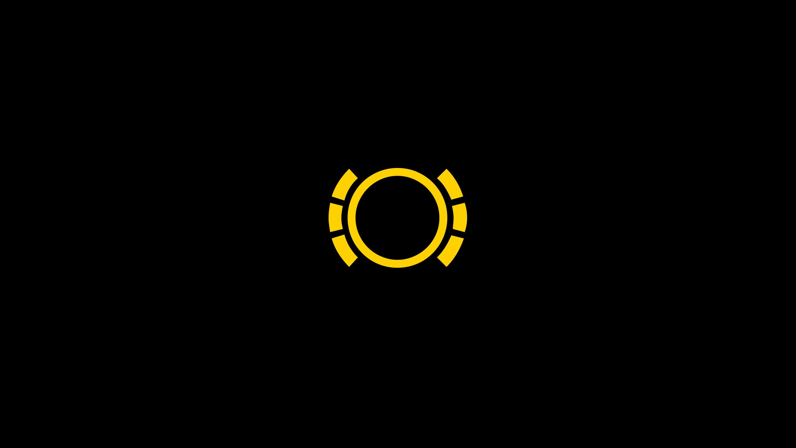 Ein schwarzes Bild mit einem gelben, kreisförmigen Symbol in der Mitte. Das Symbol besteht aus einem durchgehenden Kreis, umgeben von sechs kurzen, gebogenen Linien. Die gelben Linien sind gleichmäßig um den Kreis angeordnet.