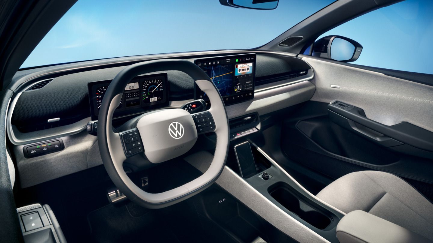 Blick durch die offene Fahrertür auf das Cockpit des VW ID. Polo Style.