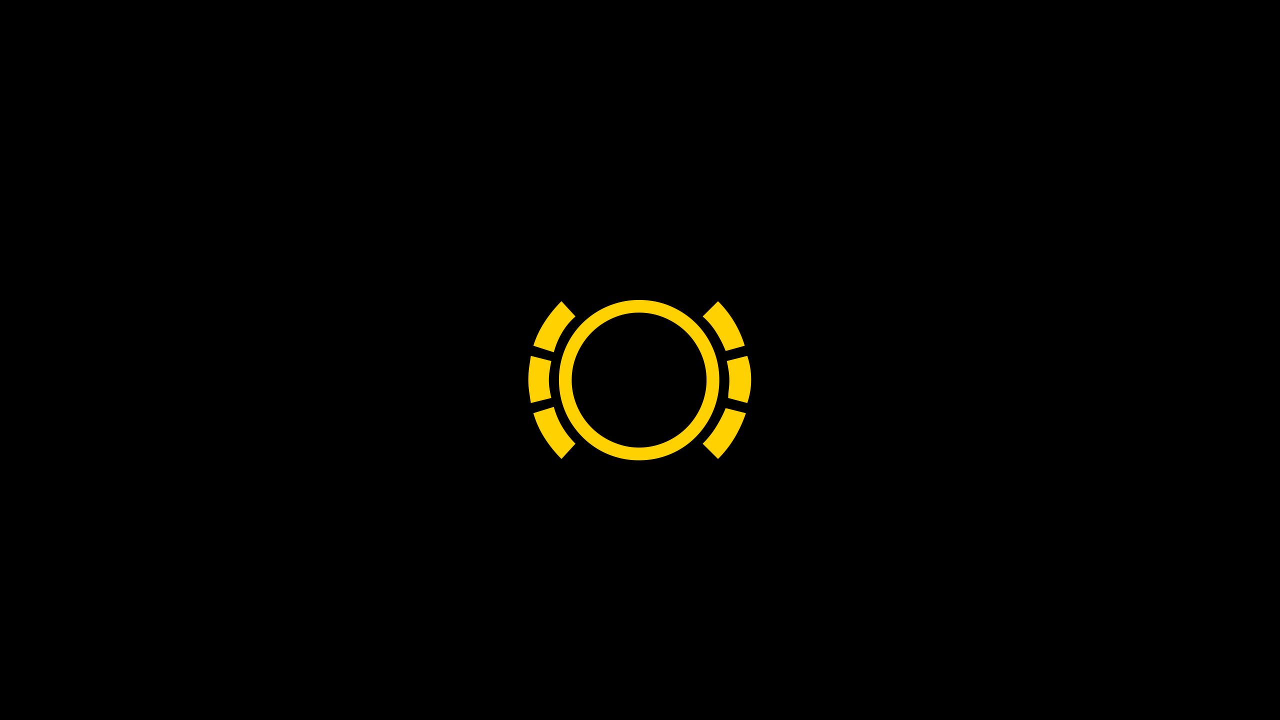 Ein schwarzes Bild mit einem gelben, kreisförmigen Symbol in der Mitte. Das Symbol besteht aus einem durchgehenden Kreis, umgeben von sechs kurzen, gebogenen Linien. Die gelben Linien sind gleichmäßig um den Kreis angeordnet.