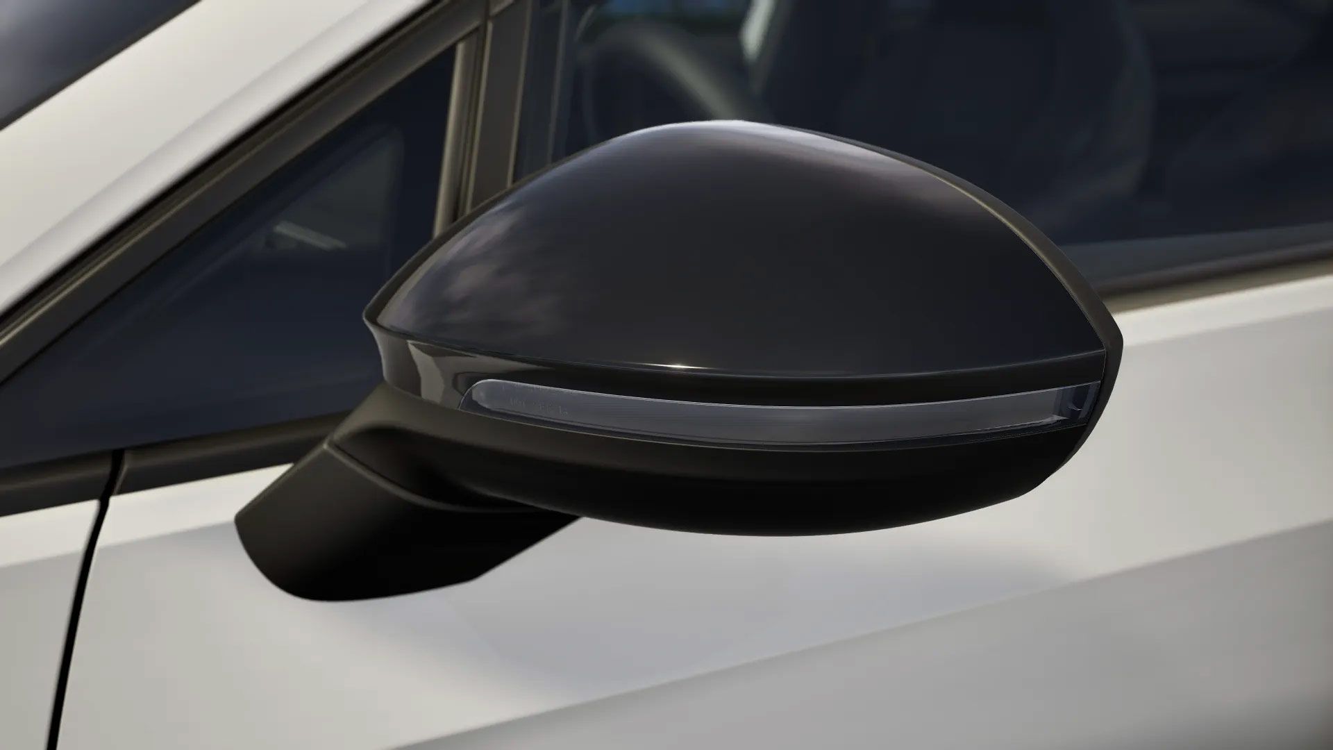 Nahaufnahme eines schwarzen Golf Variant Außenspiegels mit integrierter LED-Leiste. Der Golf Variant ist weiß und der Hintergrund unscharf. Der Spiegel hat ein modernes und aerodynamisches Design.